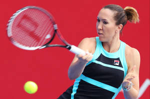 Jelena Jankovic Executing A Powerful Forehand Stroke In A Tennis Match. Wallpaper