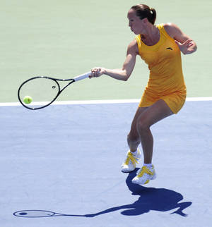 Jelena Jankovic Gracefully Executing A Forehand Stroke On Court Wallpaper