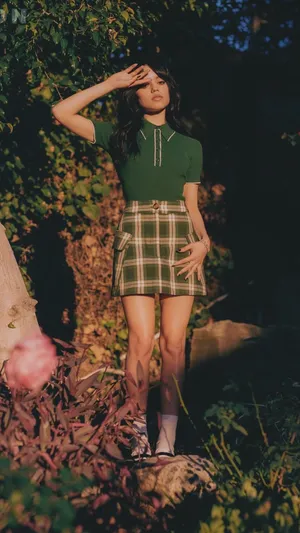 Jenna Ortega Green Outfit Nature Backdrop Wallpaper