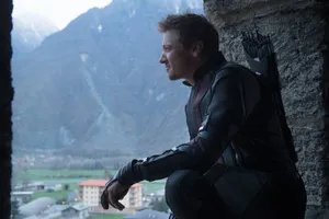 Jeremy Renner Gazing In The Window Wallpaper