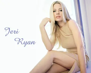 Jeri Ryan Striking A Stylish Pose In A Black Outfit Wallpaper