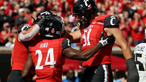 Jerome Ford Celebrating Touchdown With Teammate Wallpaper