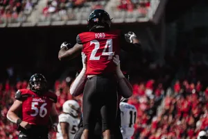 Jerome Ford Celebration With Teammate Wallpaper