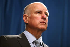 Jerry Brown Against Dark Blue Wallpaper