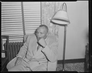 Jersey Joe Walcott Sitting In His Office Wallpaper