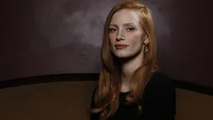 Jessica Chastain Posing Elegantly In A Stunning Blue Dress. Wallpaper