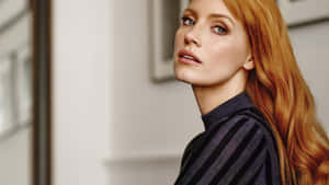 Jessica Chastain Striking A Pose In A Stunning Photoshoot Wallpaper