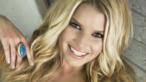 Jessica Simpson With A Blue Ring Wallpaper