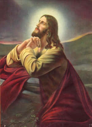 Jesus Praying With His Hands On His Knees Wallpaper