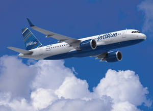 Jetblue Airways Airplane Flying By Clouds Wallpaper