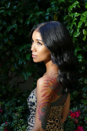 Jhene Aiko Dazzling In A Candid Pose Wallpaper