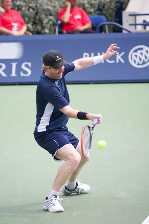 Jim Courier Displaying Expert Tennis Skills Wallpaper
