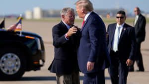 Jim Inhofe Hugging Trump At Airport Wallpaper