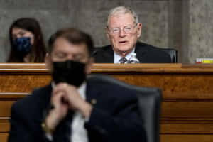 Jim Inhofe In The Background Wallpaper