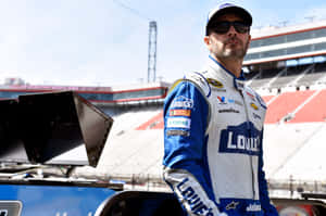 Jimmie Johnson Posing With His Nascar Race Car Wallpaper