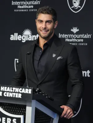 Jimmy Garoppolo In Action During A Football Game Wallpaper