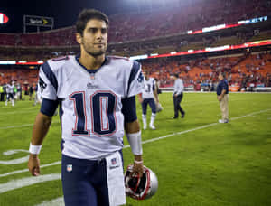 Jimmy Garoppolo In Action On The Football Field Wallpaper