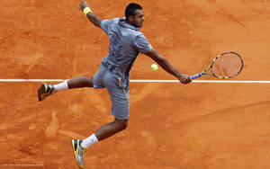 Jo-wilfried Tsonga Epic Mid-air Tennis Shot Wallpaper