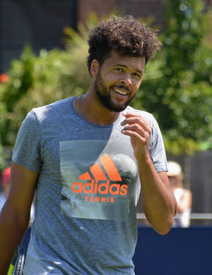 Jo-wilfried Tsonga Showcasing His Curly Hair. Wallpaper