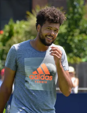 Jo-wilfried Tsonga Showcasing His Curly Hair. Wallpaper