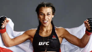 Joanna Jedrzejczyk Holding A Flag Wallpaper