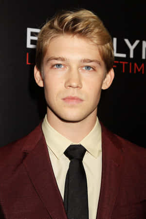 Joe Alwyn Looking Stylish In A Classic Black Suit.