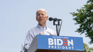 Joe Biden Delivers Powerful Speech On Stage Wallpaper