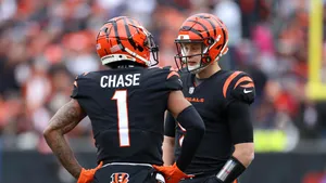 Joe Burrow Ja Marr Chase Bengals Game Strategy Discussion Wallpaper