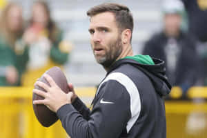 Joe Flacco Holding Football During Practice Wallpaper