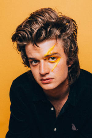 Joe Keery With Yellow Paint Wallpaper