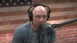 Joe Rogan Deep In Conversation On His Signature Podcast Wallpaper