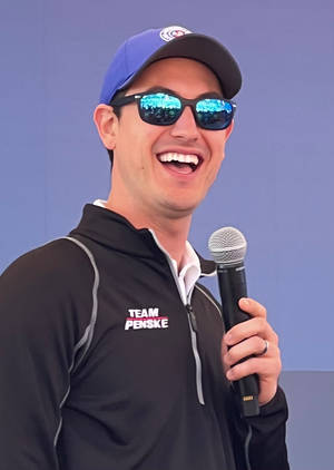 Joey Logano Holding Microphone Wallpaper