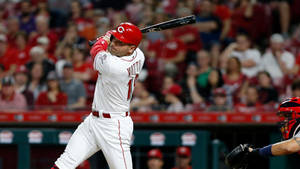 Joey Votto Swinging Bat Near Crowd Wallpaper