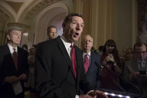 John Barrasso Speaking At Podium Wallpaper