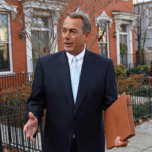 John Boehner Holding Folders At The Office Wallpaper