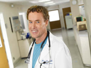 John C. Mcginley Smiling At An Event Wallpaper