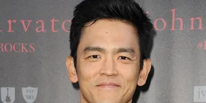 John Cho Striking A Pose At A Photoshoot. Wallpaper