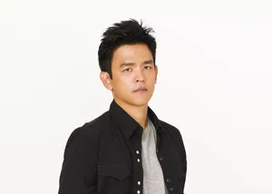 John Cho Striking A Pose In A Semi-formal Attire Wallpaper