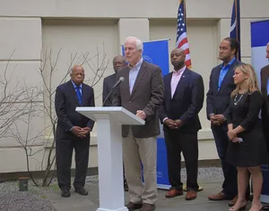 John Cornyn Speaking On A Podium Wallpaper