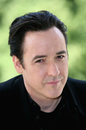 John Cusack Posing For A Portrait Wallpaper