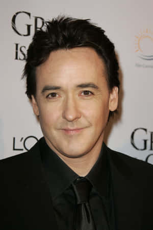 John Cusack Posing For A Portrait Wallpaper