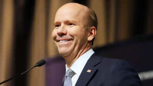 John Delaney Addressing The Audience At The Political Rally Wallpaper