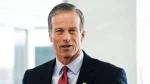 John Thune Red Tie Black Suit Wallpaper