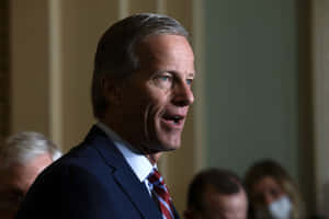 John Thune Speaking Side View Wallpaper