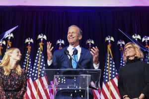 John Thune With Two Women Wallpaper