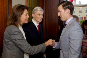 John Warner Shaking Hands With Jeanne Vander Myde Wallpaper