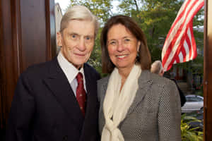 John Warner Smiling Alongside Wife Jeanne Vander Wallpaper