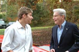 John Warner Smiling With His Son Desktop Wallpaper