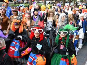 Join In The Spooky Fun Of A Local Halloween Parade! Wallpaper