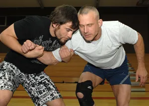 Jon Fitch Arm Grab Demonstration With Mike Veros Wallpaper